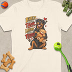Rottweiler with teddy bear on shirt saying "Built Like a Tank, Loves Like a Teddy".