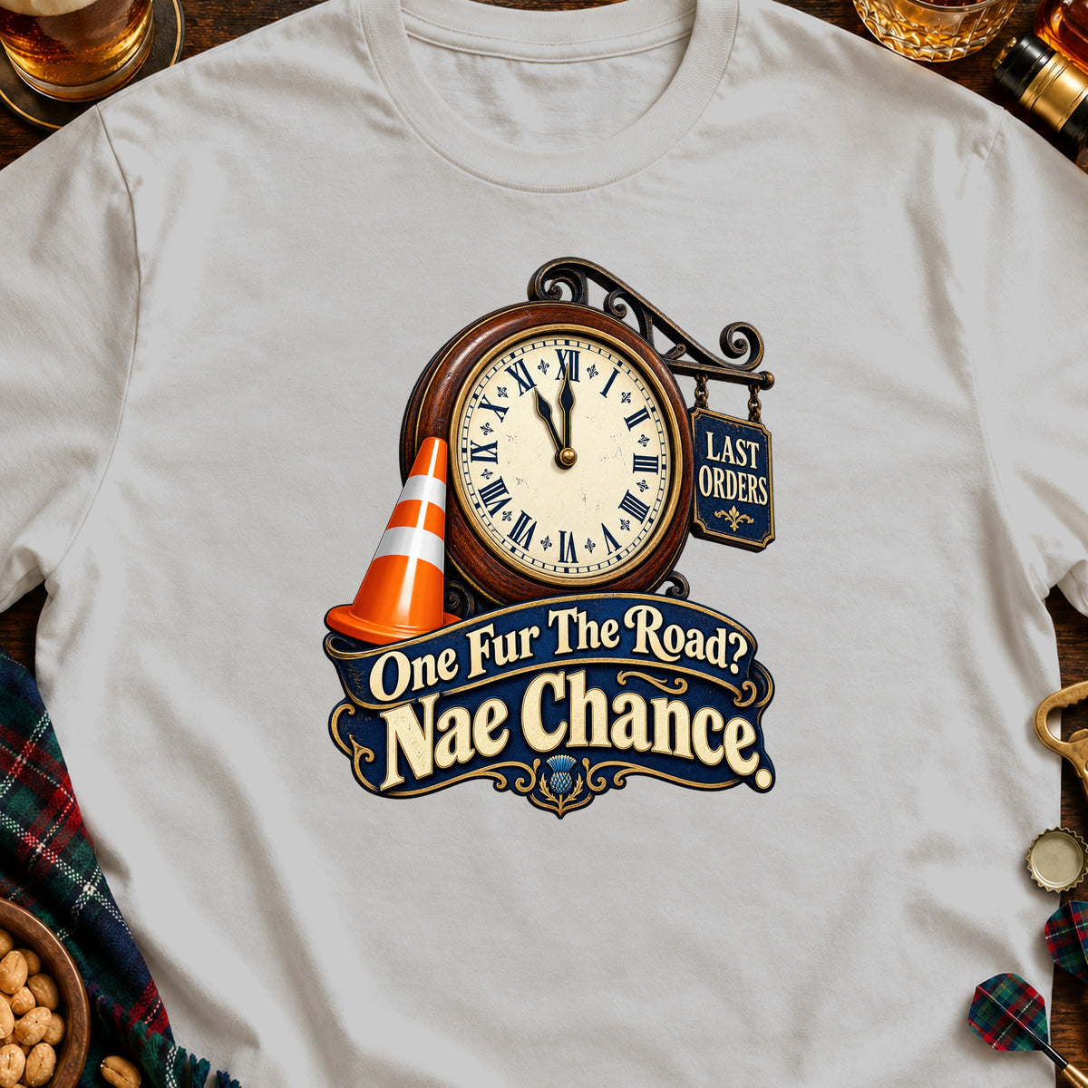 White t-shirt with a clock, traffic cone, and text "One Fur The Road? Nae Chance".