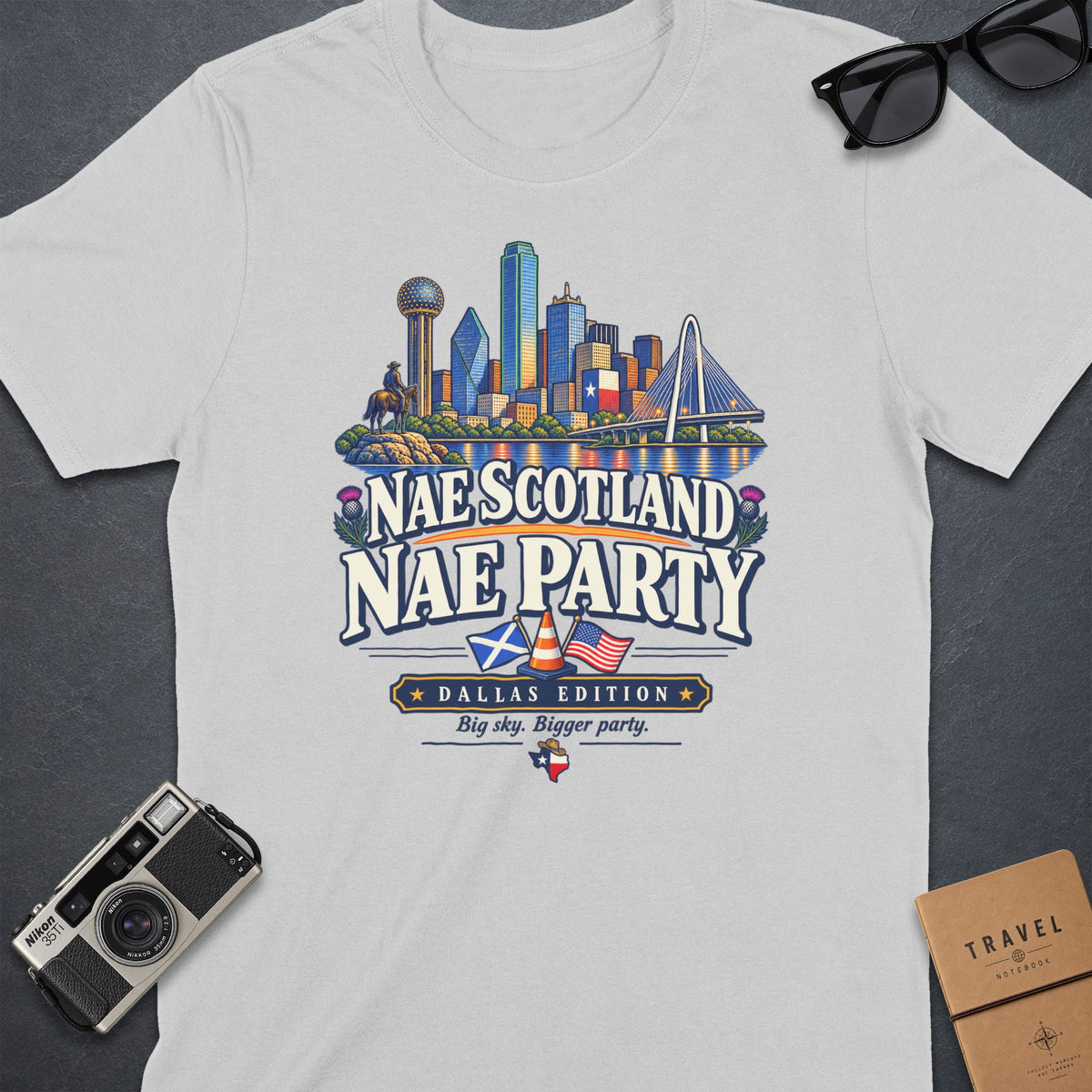 T-shirt graphic with Dallas skyline, Scottish and US flags, text "Nae Scotland Nae Party".