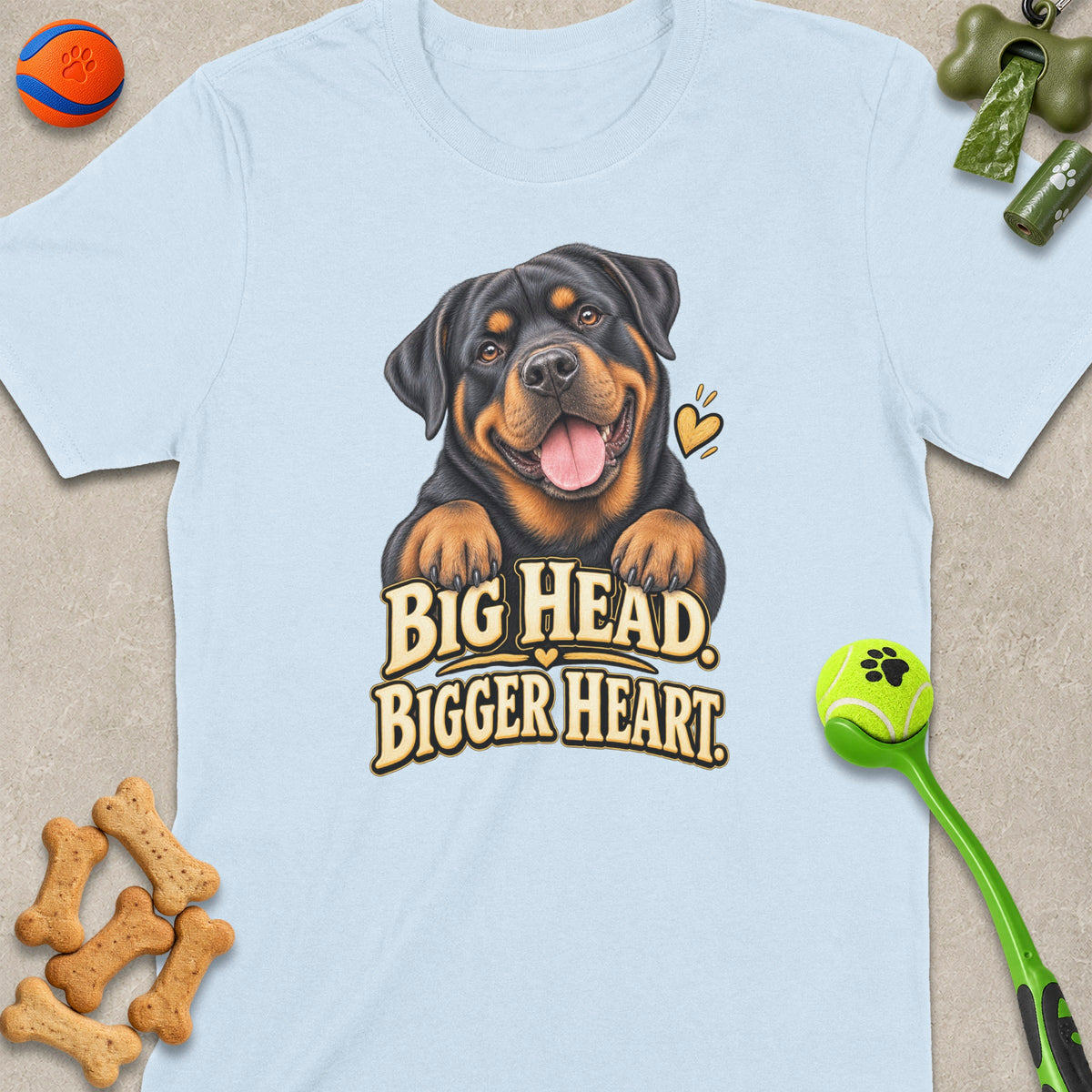 Light blue t-shirt featuring a smiling Rottweiler with "BIG HEAD. BIGGER HEART." text.