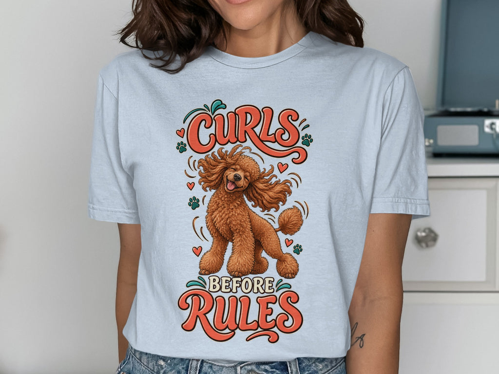 Light blue t-shirt with a brown poodle and text "Curls Before Rules".