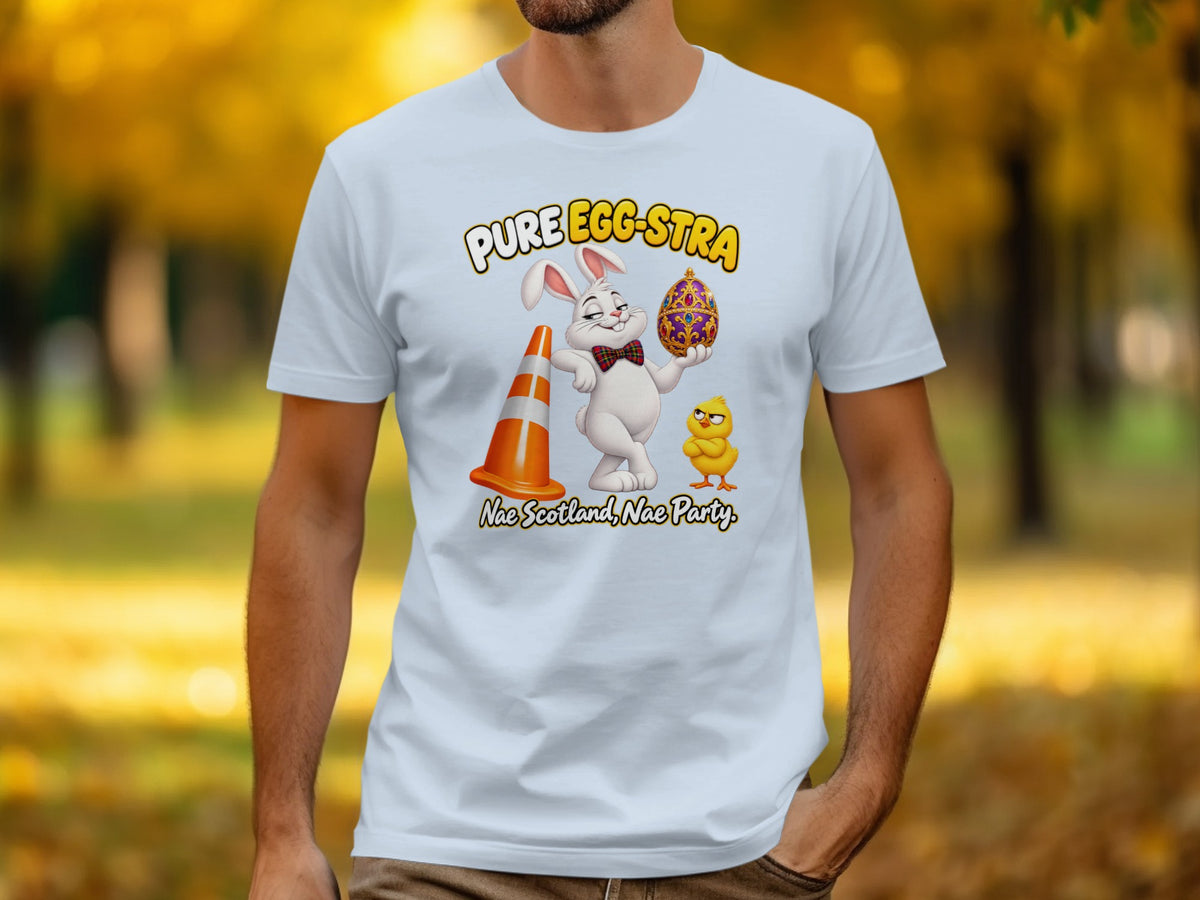 White t-shirt with cartoon Easter bunny holding an ornate egg, chick, and traffic cone.