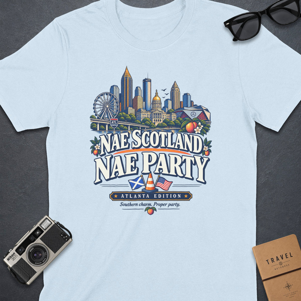 Light blue t-shirt with "Nae Scotland Nae Party Atlanta Edition" graphic and Atlanta skyline.