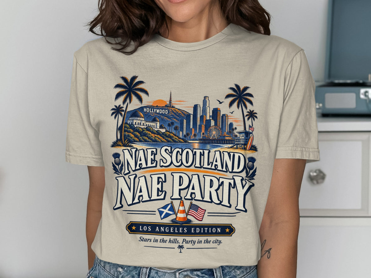 T-shirt graphic with Hollywood skyline, palm trees, and text "Nae Scotland Nae Party".