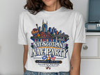 White t-shirt with Nashville skyline, guitars, and text "NAE SCOTLAND NAE PARTY".
