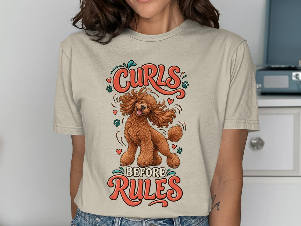 T-shirt graphic with a poodle and text that reads "Curls Before Rules".