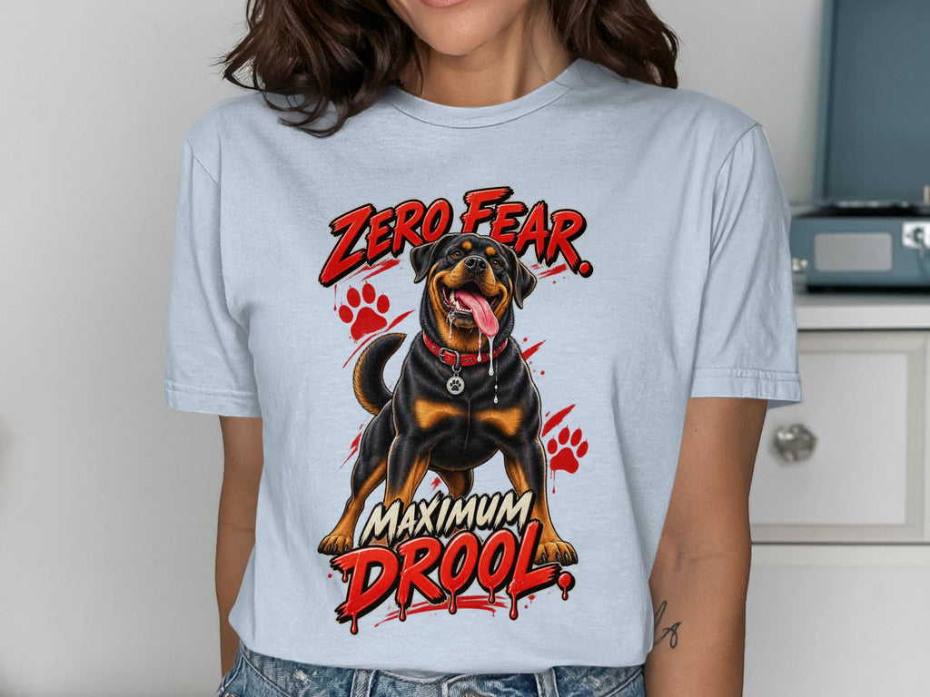 Light blue t-shirt with a Rottweiler graphic and the text "ZERO FEAR, MAXIMUM DROOL".
