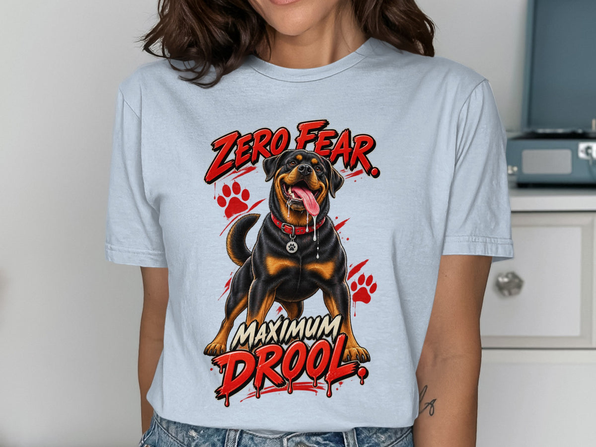 Light blue t-shirt with a Rottweiler graphic and the text "ZERO FEAR, MAXIMUM DROOL".