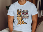 German Shepherd with "Security System Included" text on white t-shirt.
