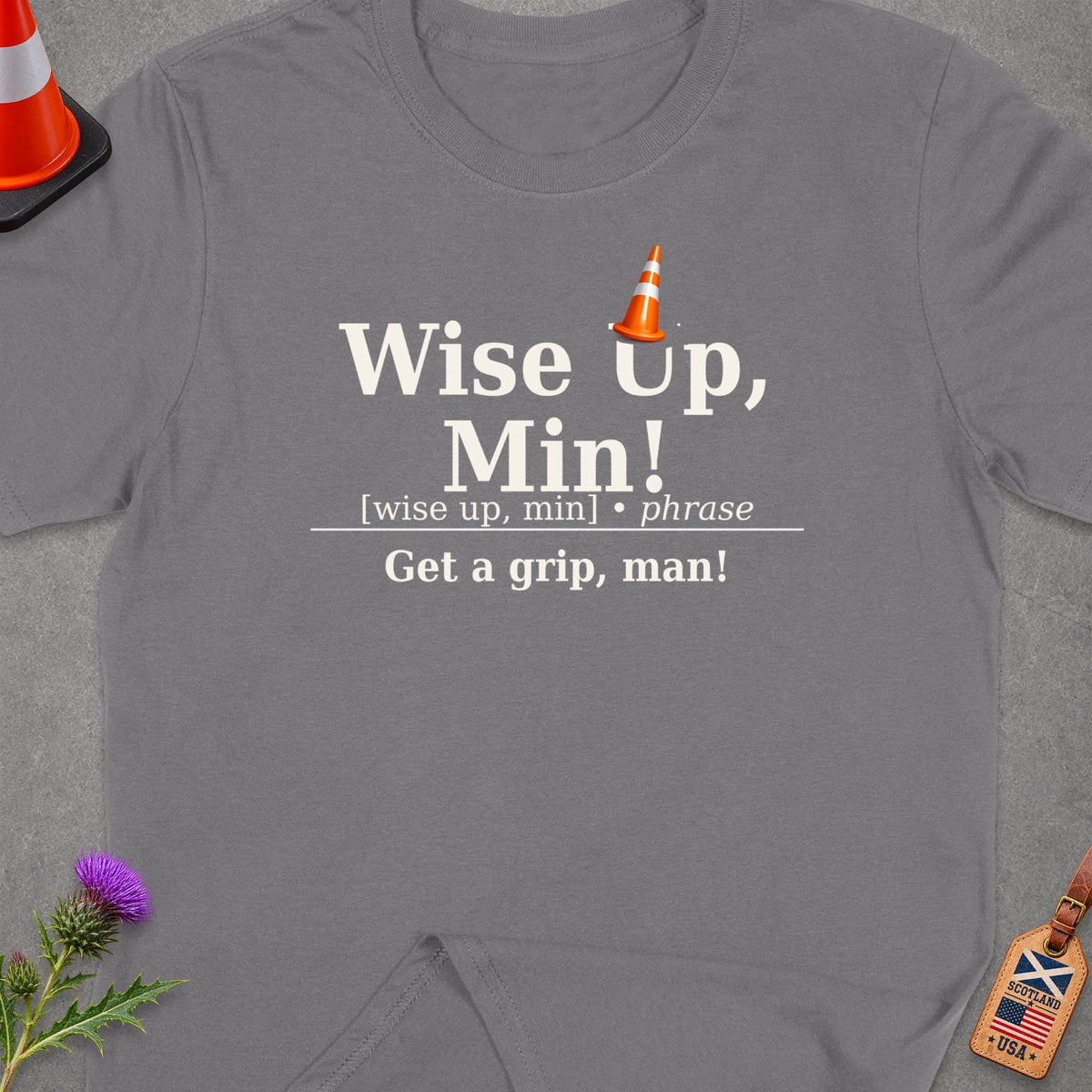 Grey t-shirt with "Wise Up, Min! Get a grip, man!" text and traffic cone graphic.