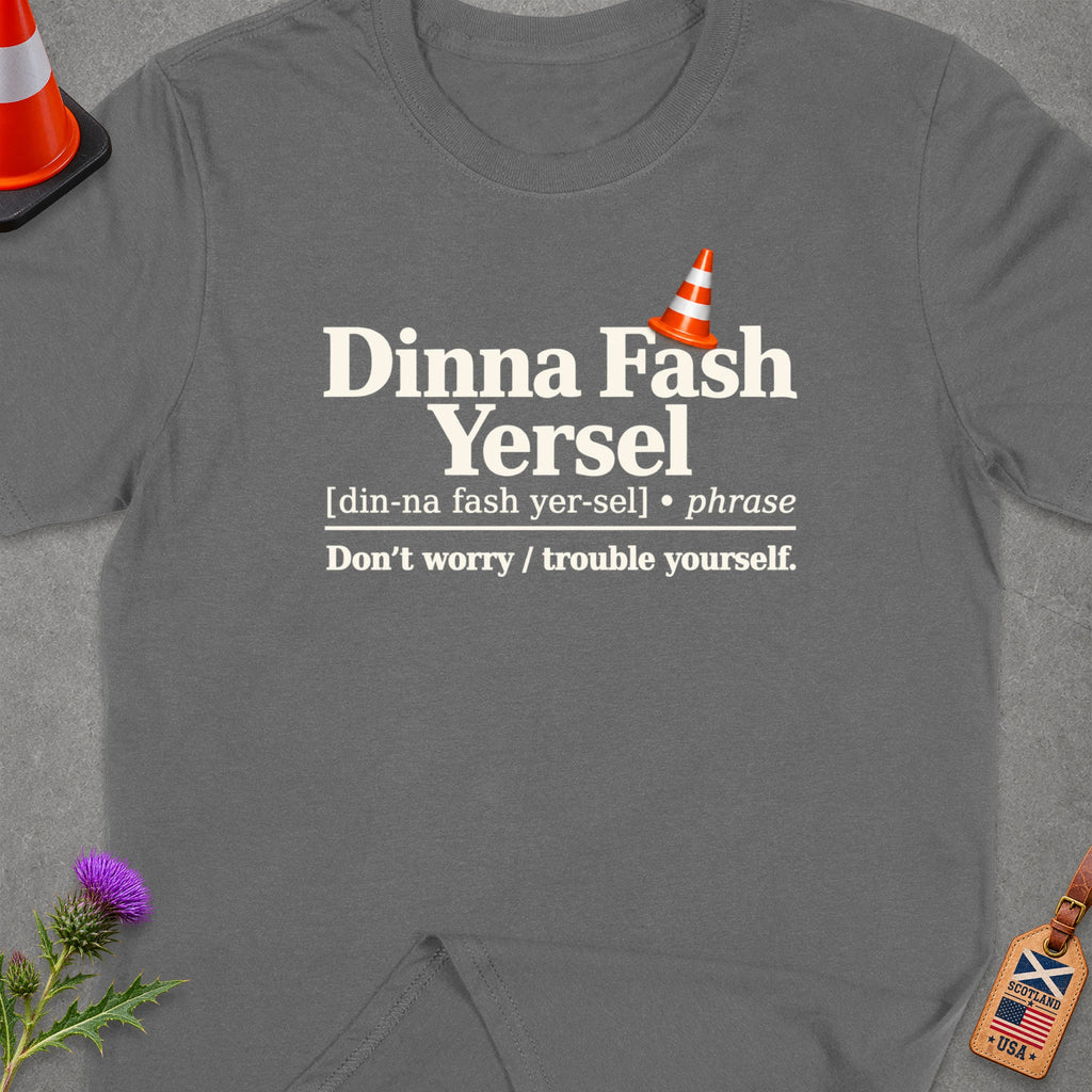 Gray t-shirt with Scottish phrase "Dinna Fash Yersel" and its English translation.