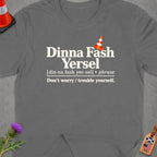 Gray t-shirt with Scottish phrase "Dinna Fash Yersel" and its English translation.