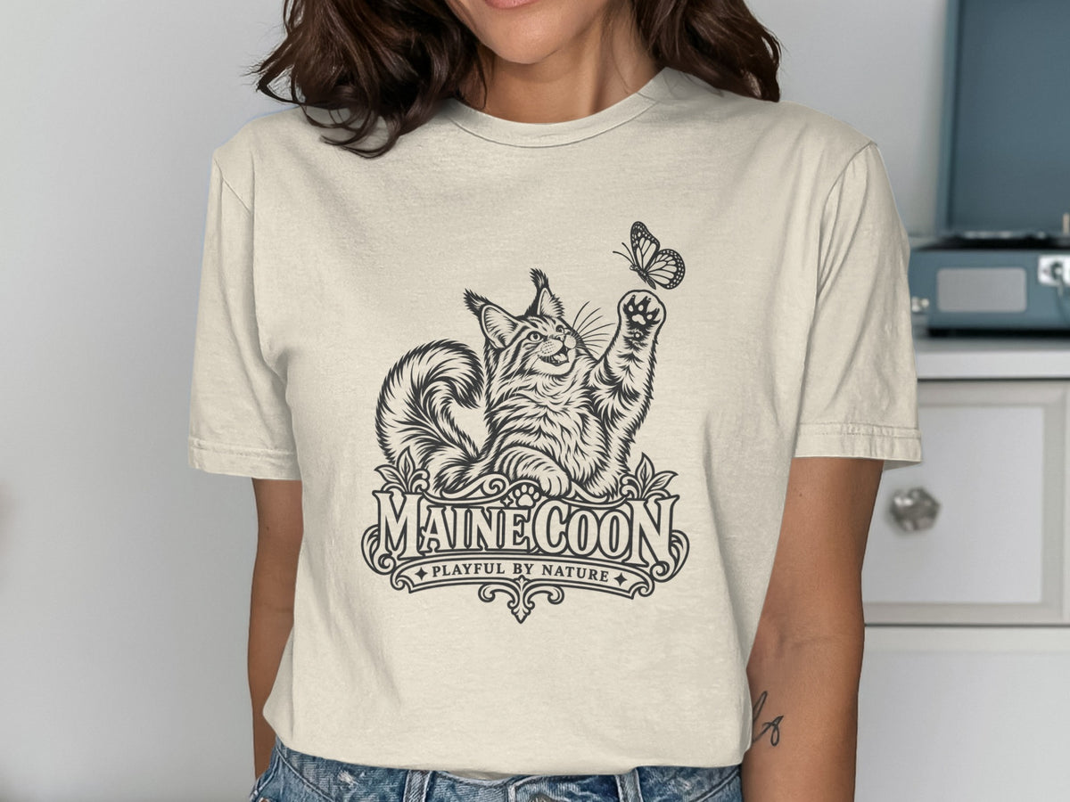 Maine Coon cat reaching for a butterfly with "MAINE COON PLAYFUL BY NATURE" text.