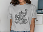 Line art of a Maine Coon cat reaching for a butterfly, with "MAINE COON PLAYFUL BY NATURE" text.
