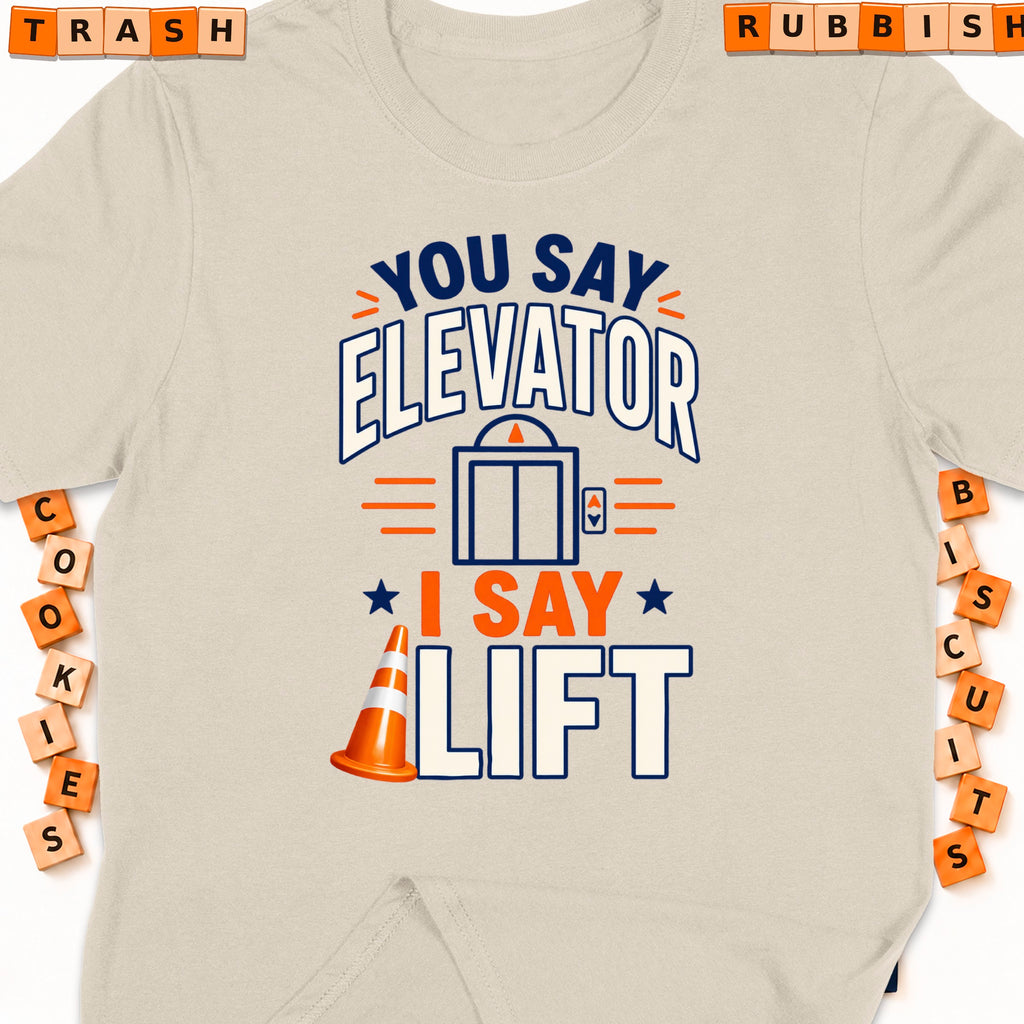 Cream t-shirt with graphic: "You say Elevator, I say Lift" and an elevator icon.