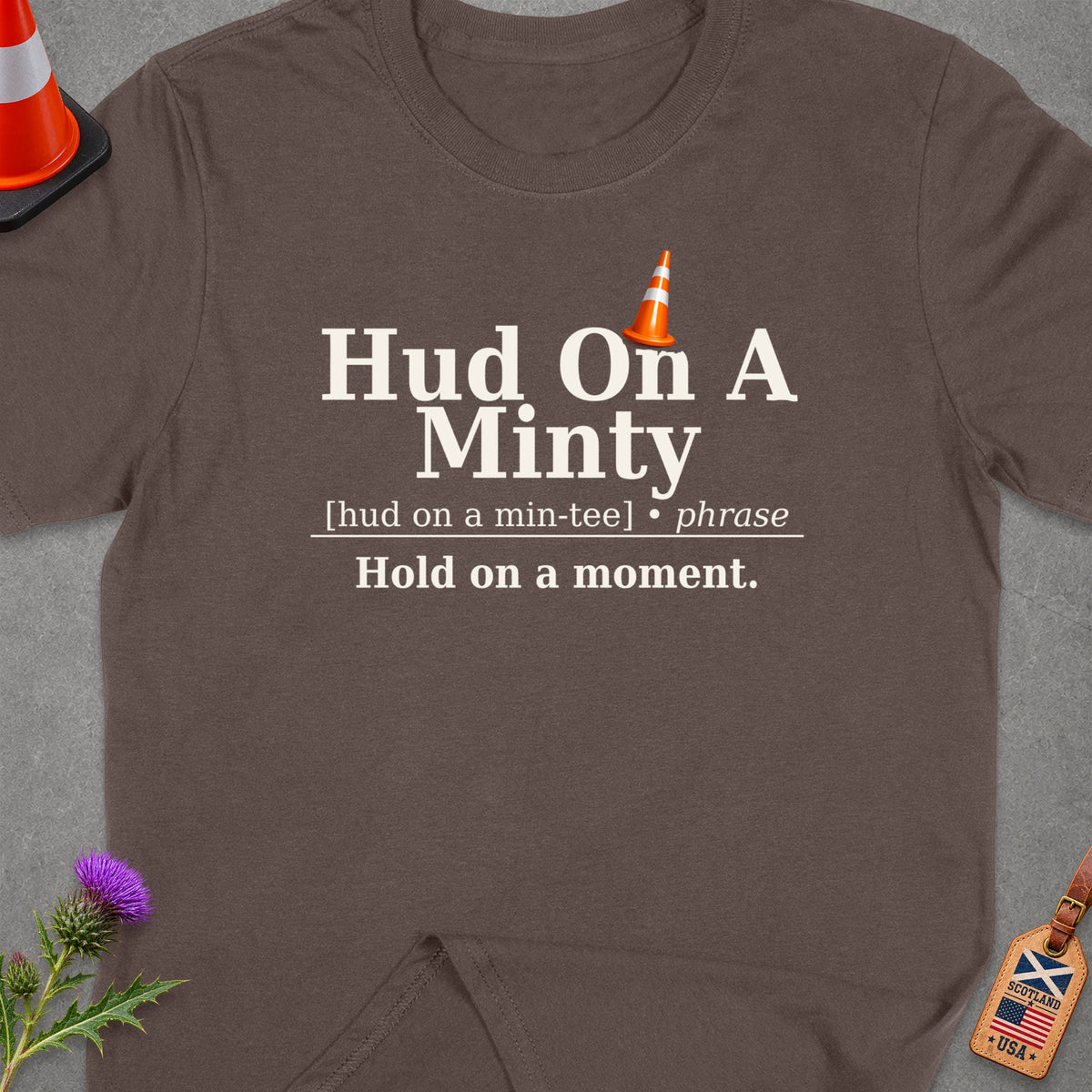 Brown t-shirt with "Hud On A Minty" text and traffic cone graphic.