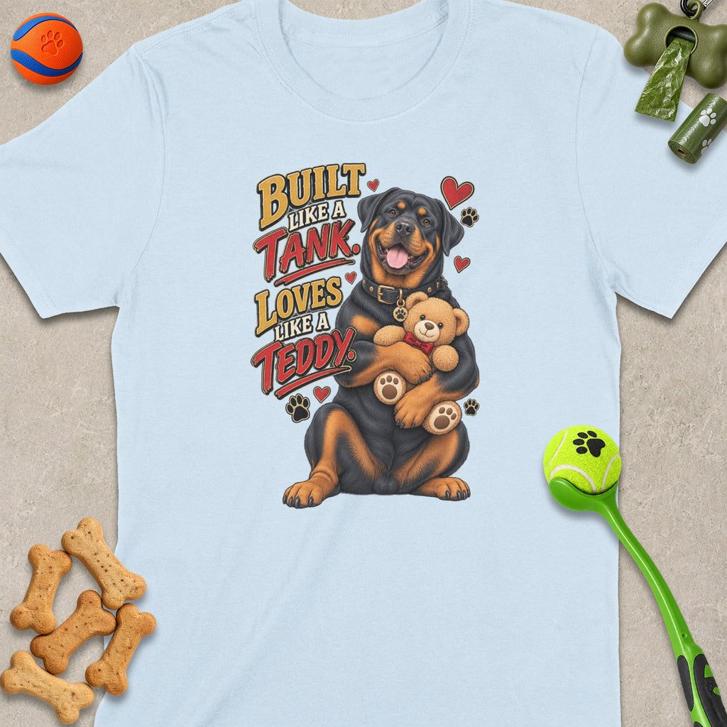 Rottweiler hugging a teddy bear with text "Built Like a Tank, Loves Like a Teddy".