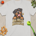 White t-shirt with a smiling Rottweiler and text "BIG HEAD BIGGER HEART".