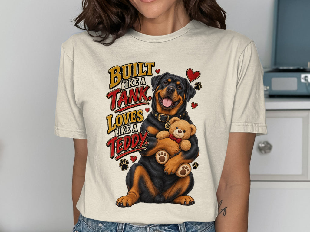 Rottweiler holding teddy bear with text "Built like a tank loves like a teddy."
