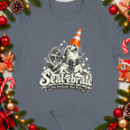 Seal wearing scarf and cone hat with text "Seal-ebrate Nae Scotland, Nae Party".