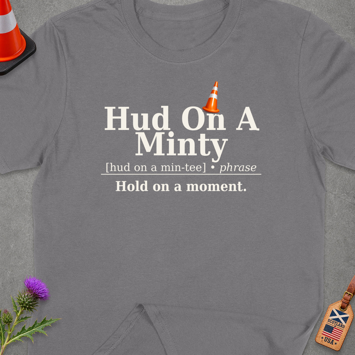Grey t-shirt with text "Hud On A Minty. Hold on a moment."