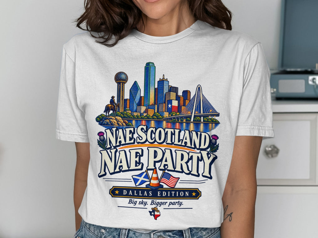 White t-shirt graphic with Dallas skyline, Scottish thistles, and text "Nae Scotland Nae Party".