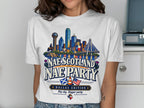 White t-shirt graphic with Dallas skyline, Scottish thistles, and text "Nae Scotland Nae Party".