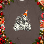 Seal wearing a cone hat and scarf, with text "Seal-ebrate Nae Scotland, Nae Party."