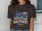 Brown t-shirt with Seattle skyline, mountains, and text "NAE SCOTLAND NAE PARTY SEATTLE EDITION".