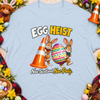 Two cartoon bunnies carry an Easter egg, with text "EGG HEIST" and "Nae Scotland, Nae Party".