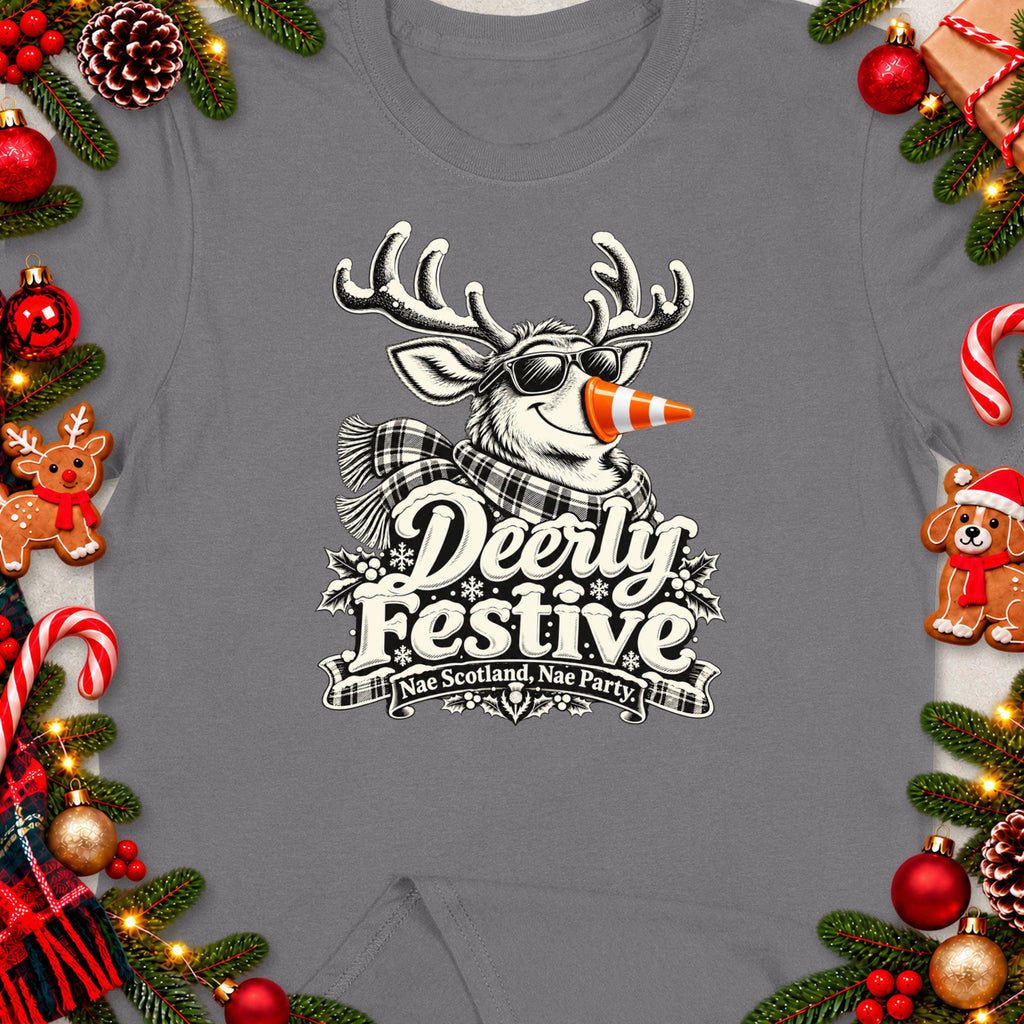T-shirt with a Christmas-themed graphic of a reindeer wearing sunglasses and a scarf, with text "Deerly Festive Nae Scotland, Nae Party".