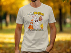 T-shirt with cartoon Easter bunny holding an egg, chick, and traffic cone. Text reads "Pure Egg-stra".