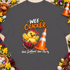 Chick hatching from a tartan egg next to a cone, with "WEE CRACKER" and "Nae Scotland, Nae Party." text.