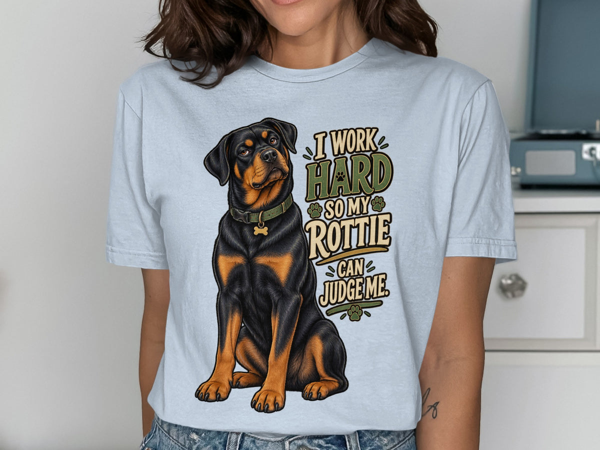 Rottweiler dog with text "I WORK HARD SO MY ROTTIE CAN JUDGE ME".