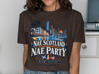 Brown t-shirt with "Nae Scotland Nae Party Miami Edition" text and a cityscape.