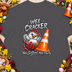 Tartan chick hatching from egg next to traffic cone, text: Wee Cracker, Nae Scotland, Nae Party.