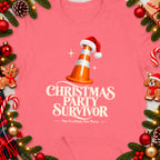 Pink t-shirt with "Christmas Party Survivor" text and a traffic cone wearing a Santa hat.