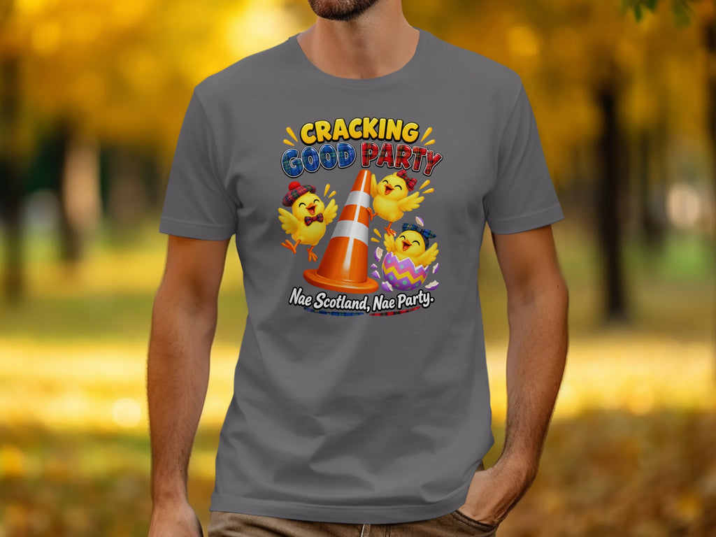 T-shirt with three cartoon chicks celebrating around a traffic cone and egg.