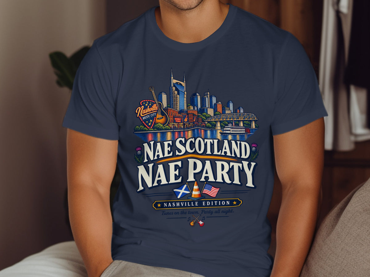 T-shirt graphic with Nashville skyline, guitar, and text "Nae Scotland Nae Party Nashville Edition".