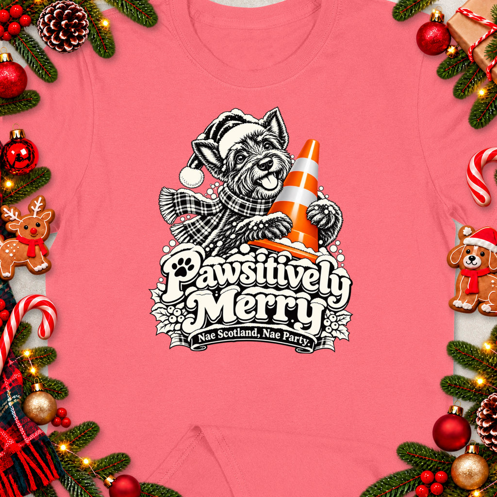 T-shirt featuring a dog in a Santa hat holding a traffic cone with "Pawsitively Merry" text.