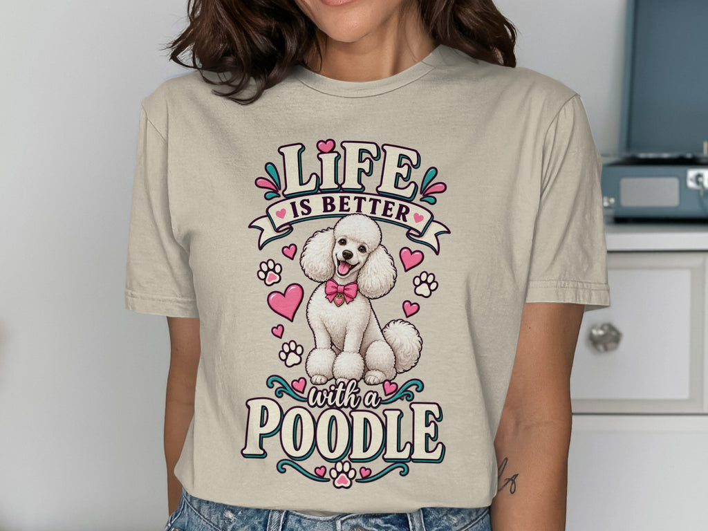 T-shirt graphic with white poodle, pink bows, hearts, and text "LIFE IS BETTER with a POODLE".