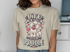 T-shirt graphic with white poodle, pink bows, hearts, and text "LIFE IS BETTER with a POODLE".