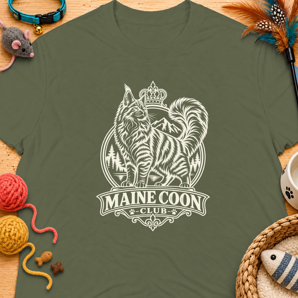 Green t-shirt with a cream "Maine Coon Club" crest featuring a crowned cat and mountains.