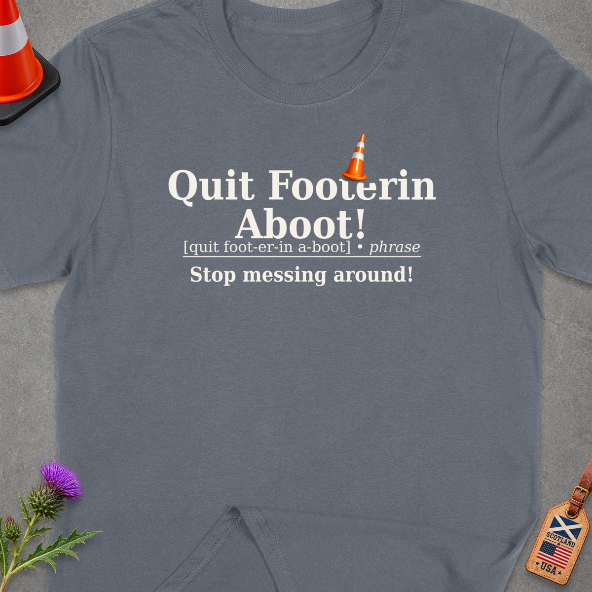 Grey t-shirt with "Quit Footin Aboot!" and definition.
