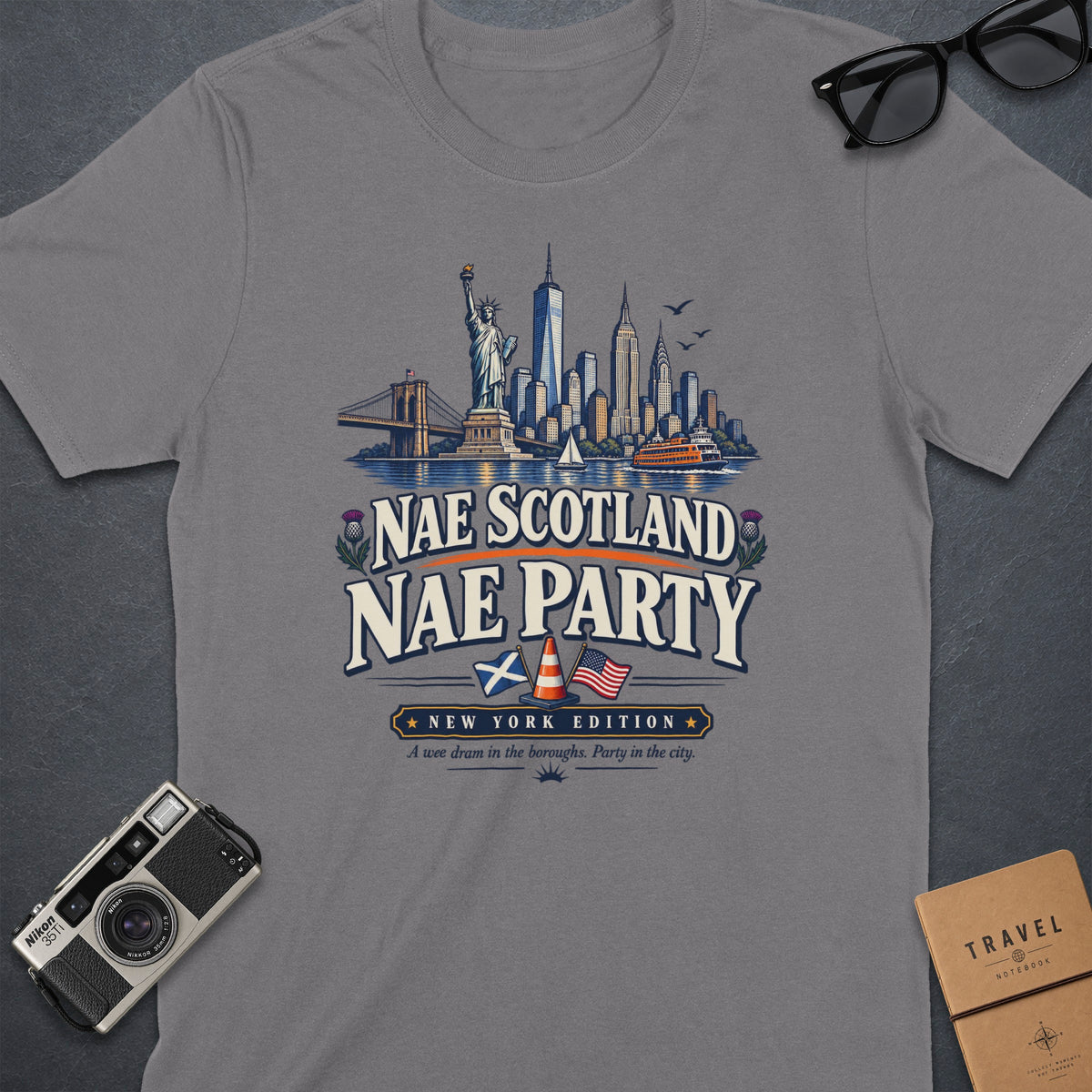 Grey t-shirt with "Nae Scotland Nae Party New York Edition" text and NYC skyline graphic.