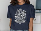 Maine Coon Club graphic on navy t-shirt featuring crowned cat and mountains.