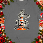 Owl in tartan hat and scarf on traffic cone with "Hoots Mon!" text.