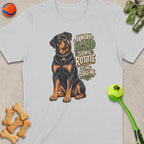 Rottweiler sitting with text "I WORK HARD SO MY ROTTIE CAN JUDGE ME."