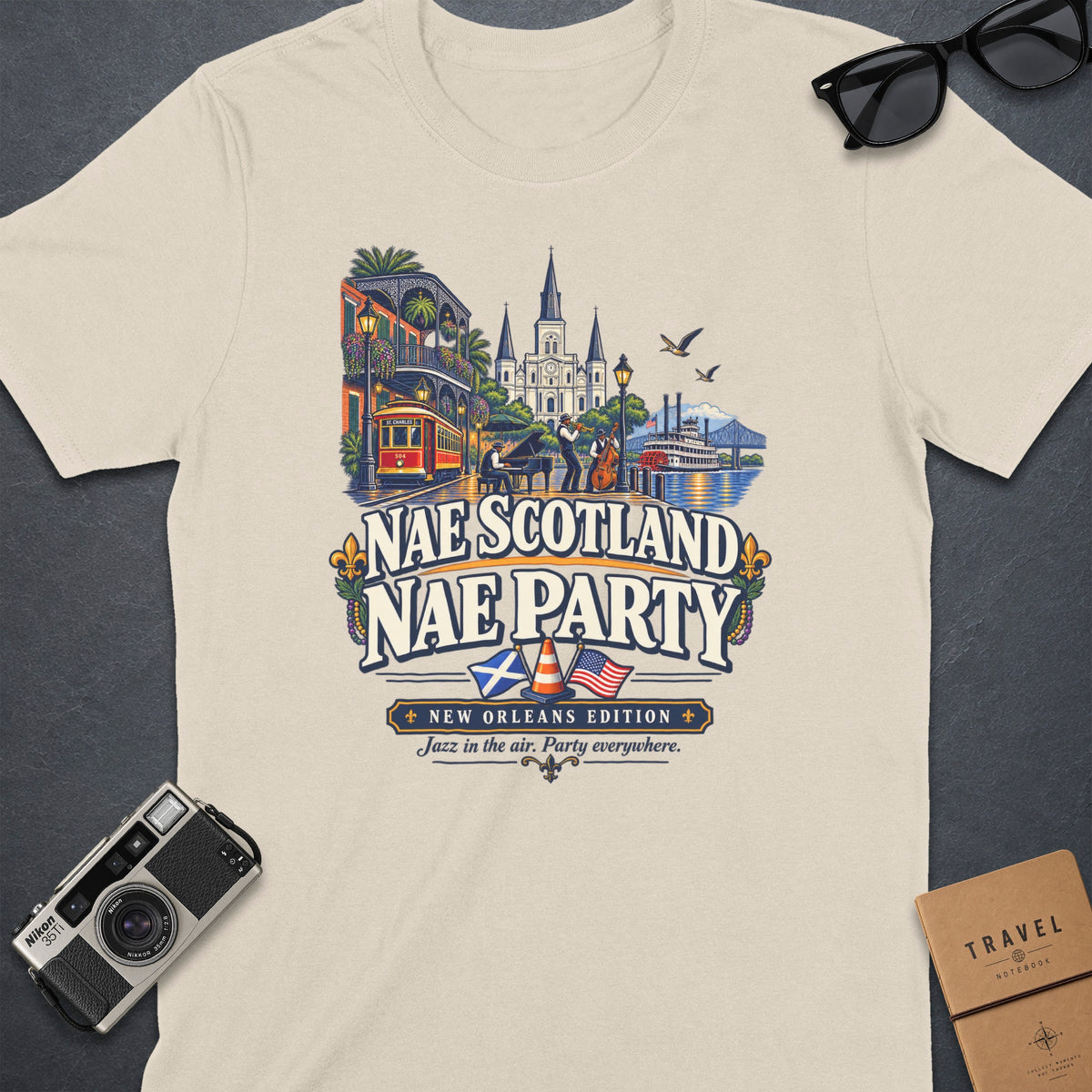 T-shirt with a New Orleans scene featuring jazz musicians, a streetcar, and a paddleboat.