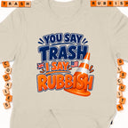 T-shirt with "You Say Trash I Say Rubbish" text and traffic cone graphic.